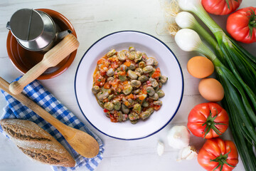 Beans with ham. Typical Spanish tapas recipe.