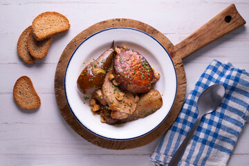Roast pork loin with pear. Typical Spanish tapa recipe.