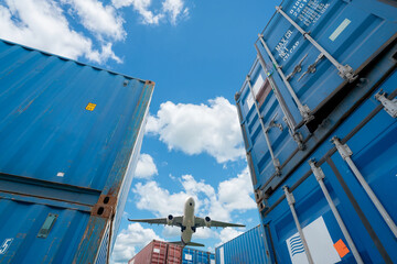 Airplane flying above logistic container. Air logistics. Cargo and shipping business. Container...