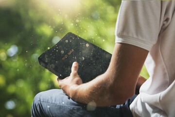 Prayer Man with bible pray on outdoor background