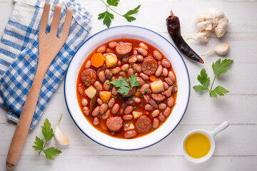 Asturian bean stew. Traditional recipe from the north of Spain with broad beans and chorizo.