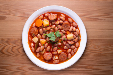 Asturian bean stew. Traditional recipe from the north of Spain with broad beans and chorizo.