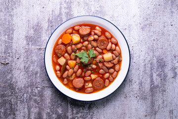 Asturian bean stew. Traditional recipe from the north of Spain with broad beans and chorizo.