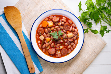 Asturian bean stew. Traditional recipe from the north of Spain with broad beans and chorizo.