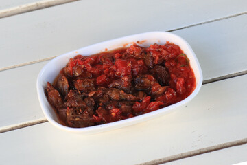 Meze or mezze is a selection of small dishes served as appetizers in much of West Asia, Middle East, and the Balkans. Meze is often served as a part of multi-course meals.