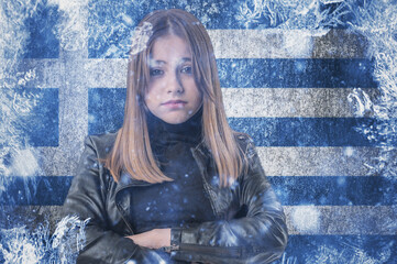 Teenage girl on frozen background with flag of Greece. Concept of crisis in Europe in winter....