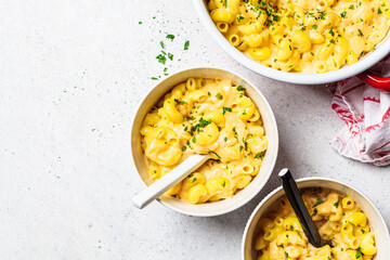 Mac and cheese in white bowl. Traditional American food.