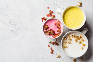 Different types of moon milk: rose flower, golden turmeric and chamomile. Ayurveda drink, healthy...