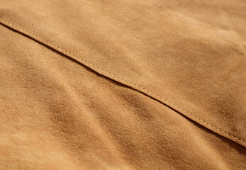 Suede leather close-up, texture of seamless sand leather, with diagonal seam