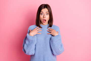 Portrait of shocked young girl hands touch chest open mouth staring isolated on pink color background