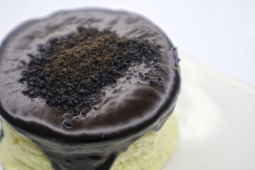 Japanese Souffle Pancake. A plate of fluffy pancake with Choco Oreo topping isolated on white background. Close up