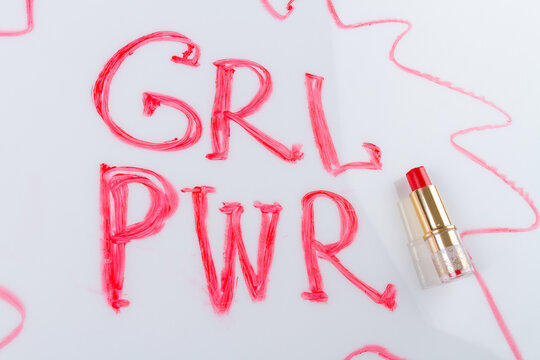 Grl pwr incription and red lipstick isolated on white background. Girl power concept.