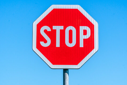 red stop sign on blue background