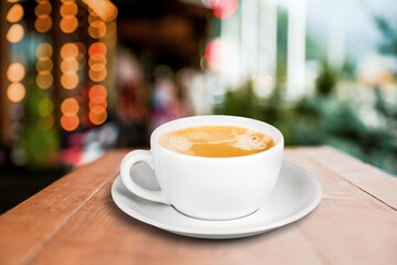 Cup of fresh aroma coffee on wooden table