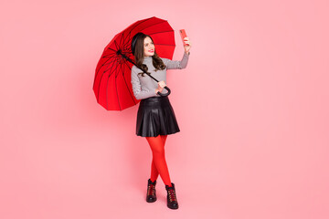Charming stylish lady influencer travel parasol make self portrait device wear pantyhose isolated pink color background