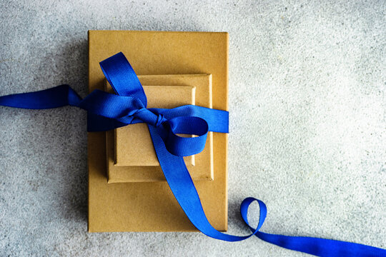Holiday gift box with blue ribbon