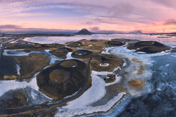 Volcanic craters near frozen lake