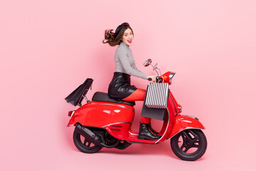 Fototapeta na wymiar Profile side photo of extreme motor bike vehicle lady driver ride store stylish buyings offer isolated pink color background