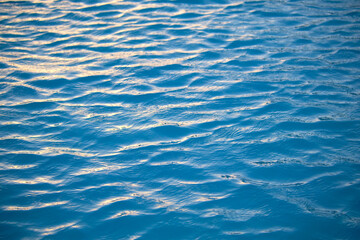 Obraz premium Closeup seascape surface of blue sea water with small ripple waves