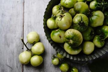 Homegrown green tomatoes still life, selective focus