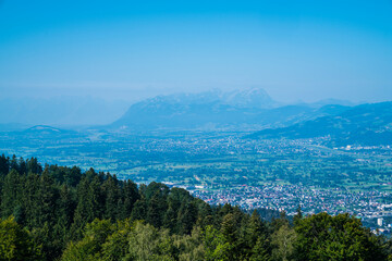Fototapeta na wymiar Austria, view above bregenz city houses and luxembourg and switzerland mountains to saentis summit snow covered panorama