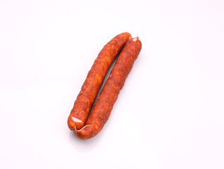 Traditional smoked pork sausage, long, isolated. Polish meat sausage, a packshot photo for package design.