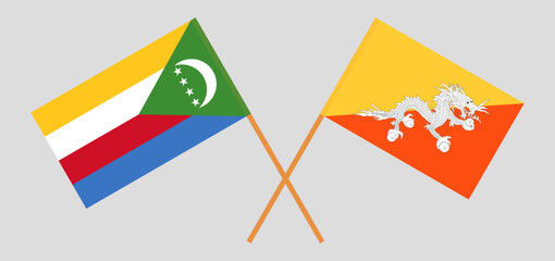 Crossed flags of the Comoros and Bhutan. Official colors. Correct proportion