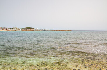 Fototapeta na wymiar Mediterranean Sea with clear water at main beach of Santa Eulalia del Rio, Ibiza
