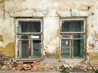 Windows in an old crumbling house.