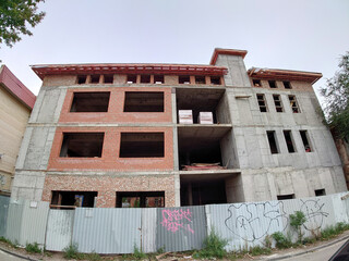 Construction of a three-storey brick house.