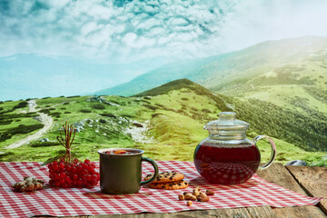 Design for wallpaper. Autumn or winter still life with hot tea with fruit, berries and spices in...