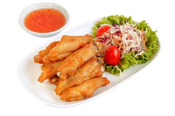 Fried chicken wings with chili sauce.