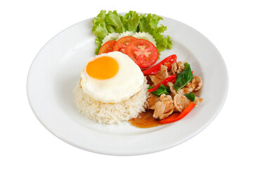 Rice with stir fried pork with hot basil and fried egg on white background, Thai food, Street food. cucumber, tomatoes side dishes.