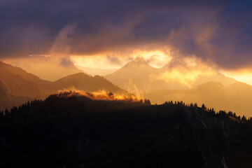 dramatic sunset with clouds in the Alpine foothills of Fribourg