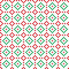 Fototapeta na wymiar Red and green cross-stitch knitting pattern on white background. Red and green cloth pattern on white backdrop. Christmas color theme fabric pattern design for sale. Knitting handicraft art.