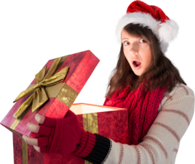 Image of surprised caucasian woman in santa hat opening big, red christmas gift box