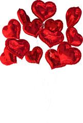 Vertical image of shiny red heart shaped balloons floating upwards