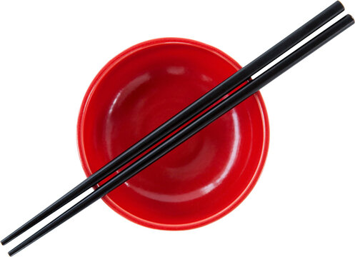 Image of overhead view of empty red bowl with black chopsticks