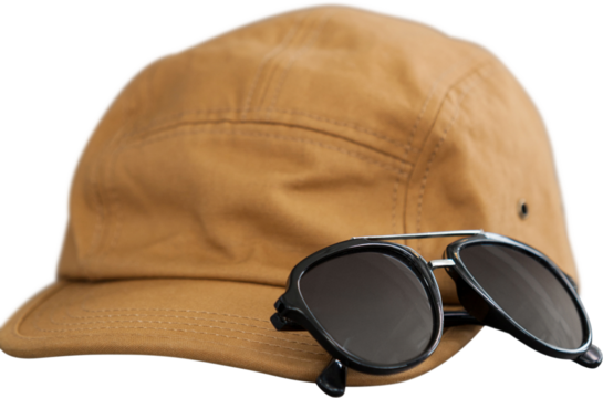 Image of brown hat with peak and sunglasses