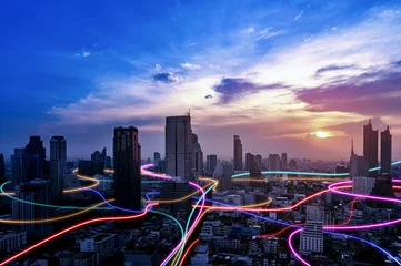 Poster Smart city with speed line glowing light trail surround the city. big data connection technology concept. © bigy9950