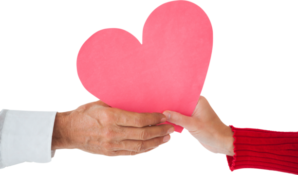 Image of hands of caucasian man and woman holding pink heart - Powered by Adobe