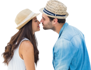 Image of happy caucasian couple wearing sunhats kissing