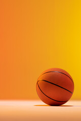 Obraz premium Image of orange basketball with copy space on orange to yellow background