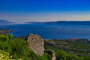ruins of an old village in Croatia on a mountain with sea in background