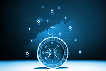 The concept of a successful way to invest and promote a business Compass with a hologram up arrows.