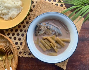 Lotus Stem with Mackerel in coconut soup - Authentic Thai food called Pla too tom Sai Bua © Saowaluck