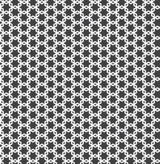 White interlaced pattern on black background. White interlocking pattern on black backdrop.