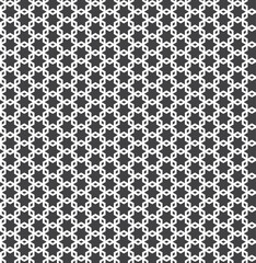 White interlaced pattern on black background. White interlocking pattern on black backdrop.