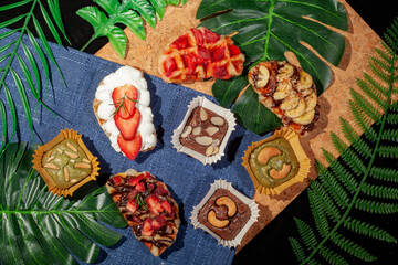 Dessert Table top view on wooden floor decorated with leaves
