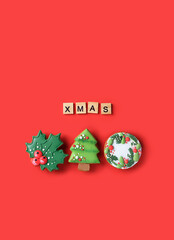 Christmas icing gingerbread cookies and wooden letter 